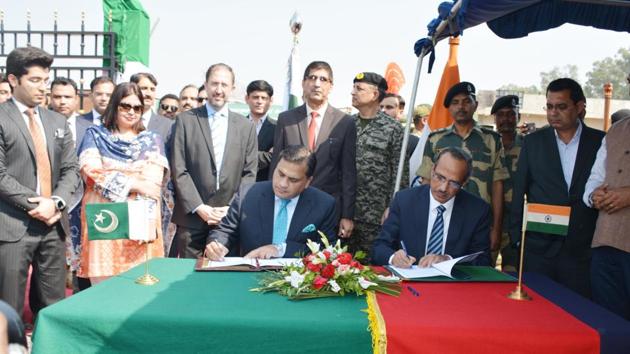 Delegates of India and Pakistan sign an agreement on the Kartarpur corridor, in Gurdaspur, Punjab. India and Pakistan signed a landmark agreement to open the historic Kartarpur Corridor to allow Indian Sikh pilgrims to visit Darbar Sahib Shrine in Pakistan. (Sameer Sehgal / HT Photo) Delegates of India and Pakistan sign an agreement on the Kartarpur corridor, in Gurdaspur, Punjab. India and Pakistan signed a landmark agreement to open the historic Kartarpur Corridor to allow Indian Sikh pilgrims to visit Darbar Sahib Shrine in Pakistan. (Sameer Sehgal / HT Photo)