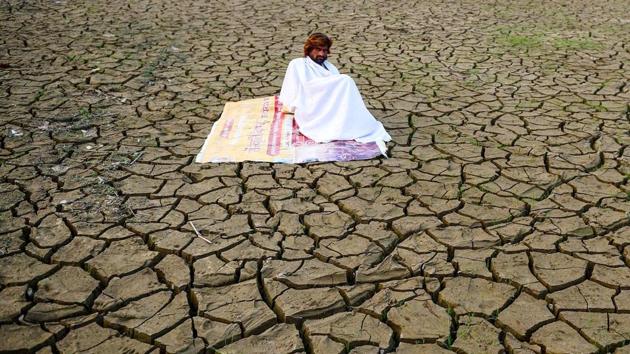 A man sits on the banks of Sangam -- the area around the confluence of rivers Ganga, Yamuna, and mythical Saraswati -- after floodwaters receded in Prayagraj. (Sanjay Kanojia / AFP) A man sits on the banks of Sangam -- the area around the confluence of rivers Ganga, Yamuna, and mythical Saraswati -- after floodwaters receded in Prayagraj. (Sanjay Kanojia / AFP)