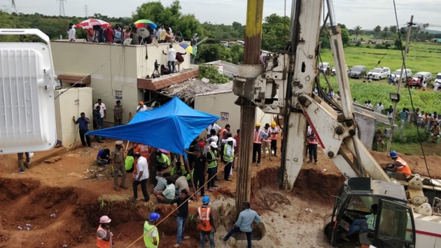 A boring machine at work near a borewell where a two-year-old child has been stuck since Friday near Trichy.(Sourced Photo)