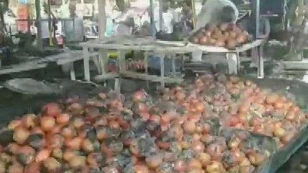 The fire is believed to have been caused by a diya (lamp) that fell over after a puja was conducted at the market. (ANI photo) The fire is believed to have been caused by a diya (lamp) that fell over after a puja was conducted at the market. (ANI photo)