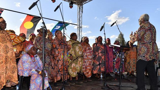 Indigenous Anangu perform during a ceremony marking the permanent ban on climbing Uluru. Previously known as Ayers Rock, the site was officially returned to the Anangu in 1985. Signs at its base had implored visitors not to climb it, but they were regularly ignored by some, especially in recent months as thousands made last-minute ascents. (Saeed Khan / AFP)