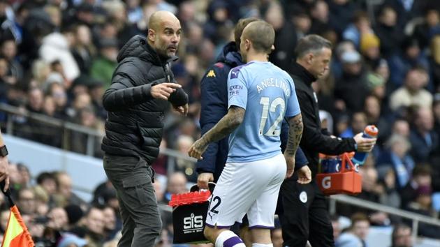 Manchester City's head coach Pep Guardiola speaks to Manchester City's Angelino. (AP) Manchester City's head coach Pep Guardiola speaks to Manchester City's Angelino. (AP)