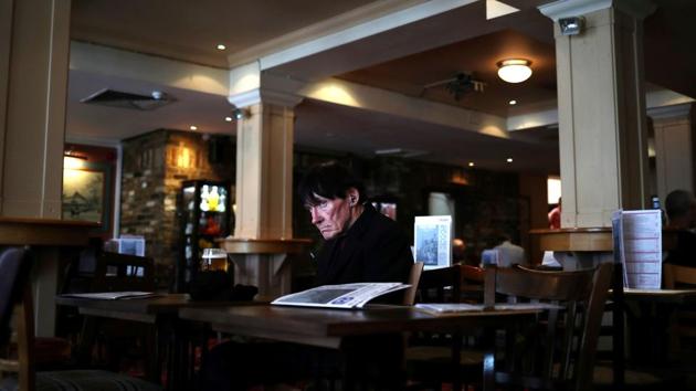A man sits on his own with a pint of beer in The Holland Tringham J D Wetherspoon pub on Streatham High Road in south London, England. Three years and four months after British voters shocked the world by deciding to become the first country to leave the EU, the nation remains divided on how, or even whether, to do it. (Hannah McKay / REUTERS)
