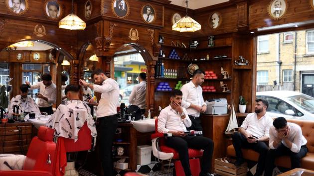 A man has his hair cut by a barber in Savvas Barbers shop on Streatham High Road. For many voters in Streatham, leaving the EU is just as worrying a prospect as it was when the referendum was held in June 2016. Much of the area lies within the borough of Lambeth where nearly four in five voters backed staying in, the strongest pro-Remain vote in Britain reflecting Streatham’s multi-cultural population. (Hannah McKay / REUTERS)