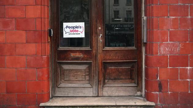 A poster in support of a second referendum at a residential building on Streatham. A no-deal Brexit, with Britain leaving the EU without a transition deal to soften the economic shock, might cause short-term disruption to the capital’s wholesale markets. Prime Minister Boris Johnson once said he would rather be “dead in a ditch” than ask for a delay to the Oct. 31 Brexit deadline --already the third such cut-off. (Hannah McKay / REUTERS)