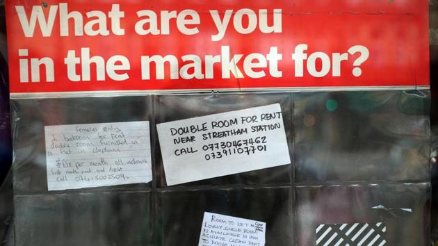 Handwritten advertisements for rooms to let are placed inside the window of a newsagents. “It looks like it will be going on for another three months and who knows, perhaps another six or seven after that,” Watkins said. “We might as well stay in. The MPs aren’t going to let us out, are they?” (Hannah McKay / REUTERS)