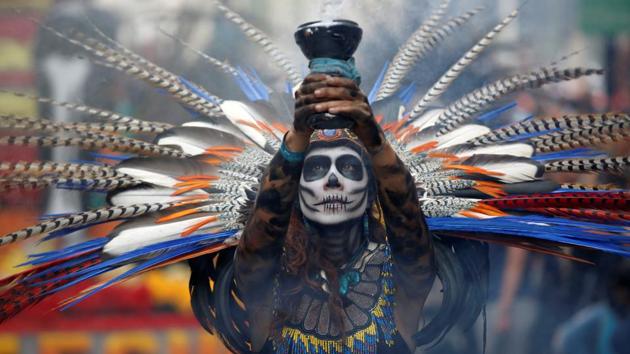 A participant holds up a censer during the annual Day of the Dead parade in Mexico City. (REUTERS)