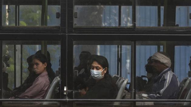 Commuters on Monday morning near Ashram. Authorities has sounded a “high alert” on Saturday and banned overnight construction work. Coal-based industries are also shut till Wednesday. This year, there were restrictions put on fireworks and only “green crackers”, with 30% fewer emissions than traditional ones, were allowed. Green crackers do not contain harmful chemicals like Barium. (Biplov Bhuyan / HT Photo)