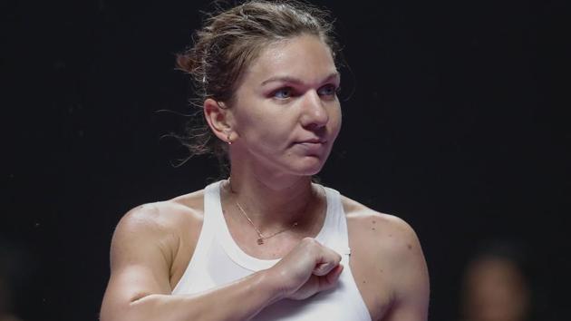 Simona Halep of Romania gestures after defeating Bianca Andreescu of Canada.(AP)