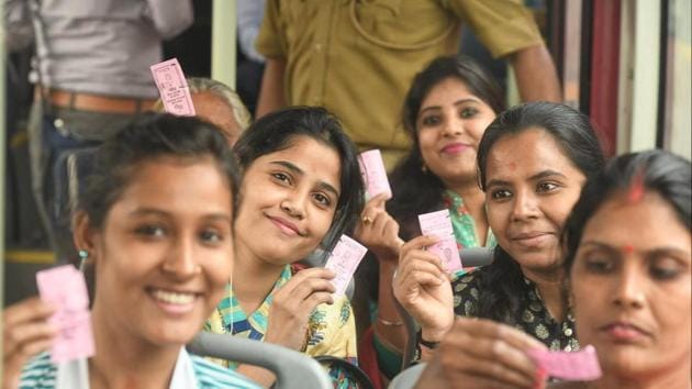 Women passengers show their free DTC tickets while travelling in east Delhi’s Laxmi Nagar.(Raj K Raj/HT Photo)