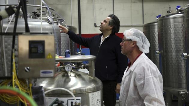 Bruce Khabbazi (C) at his distillery in Peterborough, Canada. “I was looking for something extraordinarily unique and I found the slang of a traditional popular Arak,” said Khabbazi, a 50-year-old Iranian-Canadian entrepreneur who established the Persian Empire Distillery in 2006. “I felt the need to give this drink an identity as well as originality. My task became Introducing Arak Saggi to the world as a classic alcoholic drink of Iranians.” (Kamran Jebreili / AP)