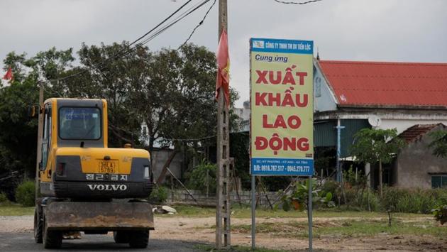 A billboard for a labour export company outside a steel mill in Ha Tinh province. “They’ll often go from Vietnam into China, and then cross into Russia,” said Mimi Vu, an independent anti-trafficking advocate in Ho Chi Minh City. “This is usually done by automobile, and then they’ll go from Russia into one of the neighbouring countries like Ukraine or Latvia on foot, crossing forests and mountains only at night.” (Kham / REUTERS)