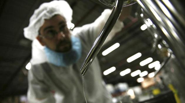 An employee checks the alcohol distilled from raisin paste. Khabbazi ‘s most prized concoction is his Arak Saggi, a liquor made of raisin paste imported from California that has a taste similar to grappa, the Italian grape-based brandy. Traditional Arak — the translucent, white and anise-flavored liquor similar in taste to the Greek ouzo or Turkish raki — is very popular in the Middle East. (Kamran Jebreili / AP)