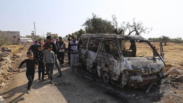 People look at a destroyed van near the village of Barisha, in Idlib province, after an operation by the US military which targeted Abu Bakr al-Baghdadi . (AP photo) People look at a destroyed van near the village of Barisha, in Idlib province, after an operation by the US military which targeted Abu Bakr al-Baghdadi . (AP photo)