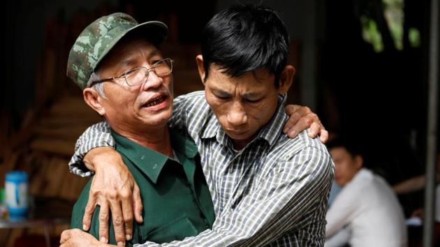 Nguyen Dinh Gia is embraced by a friend. Taking the “VIP” route typically involves using fake or recycled passports to fly from Vietnam to Europe via a third country in a process that takes days instead of months, but comes at a much higher cost. “He said, if I take the ‘grass’ route, it costs 3,000 pounds to go from France to Britain. But if he takes the ‘VIP’ route, it’ll cost 11,000 pounds,” Gia said of his 20-year-old son. (Kham / REUTERS)