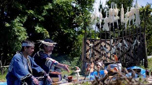 Ainu artist Koji Yuki (R) and Fukumoto Shoji, at a makeshift altar for a memorial service for Ainu tribesmen defeated in a fifteenth century battle. In 2009, after signing the UN Declaration on the Rights of Indigenous Peoples, Japan began considering how to establish a new policy for the Ainu. Early proposals zeroed in quickly on the “Symbolic Space” now taking shape. (Kim Kyung-Hoon / REUTERS)