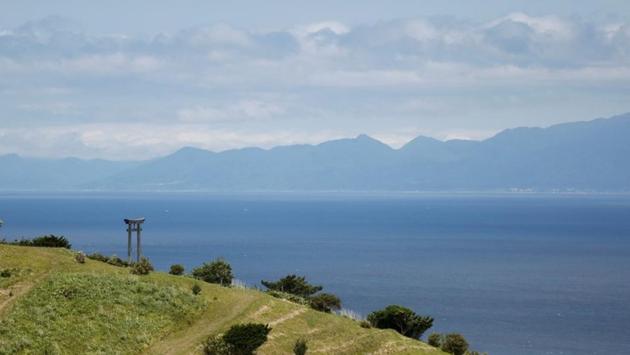 A hill stands where Japanese forces are believed to have gathered during a fifteenth century battle with indigenous Ainu tribesmen in Kaminokuni, Hokkaido Prefecture. Japan took control of Hokkaido by force in the 19th Century and made it a colony. After opening it to Japanese settlers, it forced the Ainu, which it labelled “former aborigines,” to assimilate. (Kim Kyung-Hoon / REUTERS)