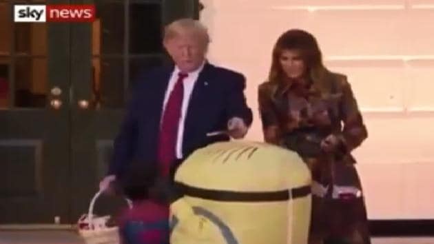 The now viral clip shows Donald Trump placing a candy bar on top of the child’s head.(Twitter)
