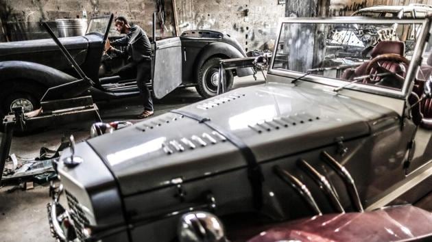 Munir al-Shindy works on vintage cars at his workshop. Parts for such models are hard enough to find in the countries where they were originally built, but in Gaza, cut off by an Israeli blockade, they are near impossible to obtain. “My hobby is vintage cars but it is difficult because of the blockade.” (Mahmud Hams / AFP)