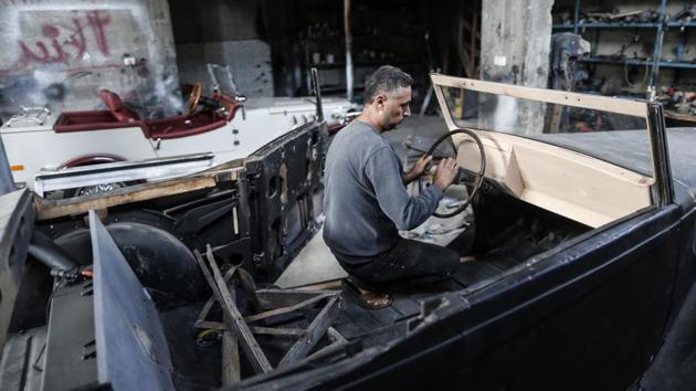 His aim is to make driving the car feel as close to the original as possible. He bought the Armstrong for around $3,000 from a man who had owned it for more than 20 years. He estimates it will cost at least another $10,000 to transform it into a working automobile. “The car was empty. Slowly I am working to complete it.” (Mahmud Hams / AFP)