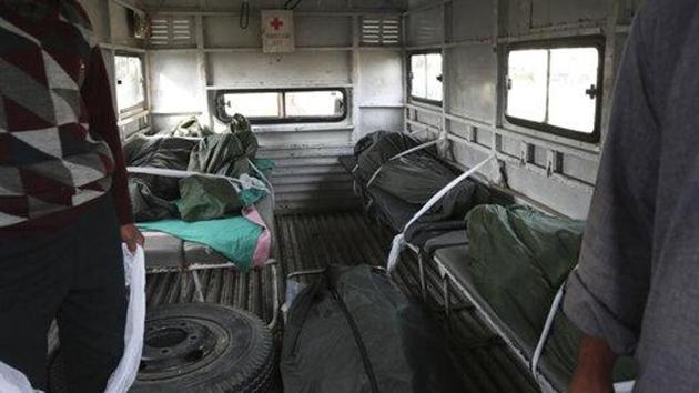 Bodies of Indian laborers who were shot dead by gunmen are seen inside an ambulance outside a hospital in Kulgam, south of Srinagar. (AP Photo) Bodies of Indian laborers who were shot dead by gunmen are seen inside an ambulance outside a hospital in Kulgam, south of Srinagar. (AP Photo)