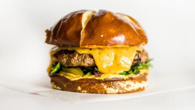 The race to eat Bangkok’s ‘biggest burger’: A 10,000-calorie challenge. (REPRESENTATIONAL IMAGE)(Unsplash)