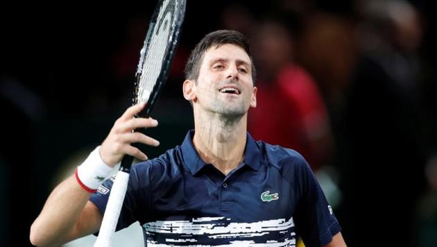 Novak Djokovic celebrates after winning his second round match against France's Corentin Moutet.(REUTERS)