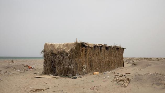 A hosh owned by smugglers where migrants stay after their arrival, in Lahj, Yemen. Nearly every migrant who lands in the nearby village of Ras al-Ara is imprisoned in hidden compounds while their families are shaken down for money. (Nariman El-Mofty / AP)
