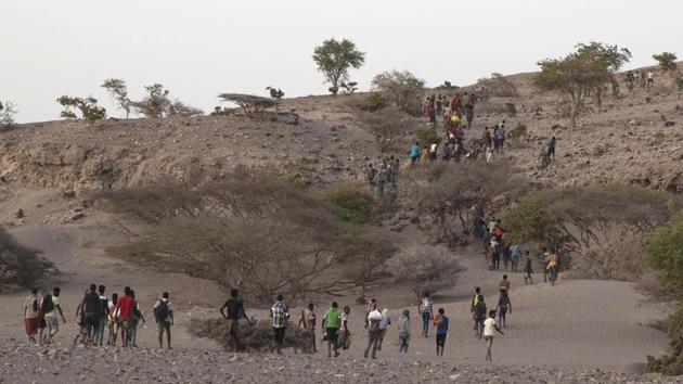 In Djibouti, long lines of migrants descend single file down mountain slopes to the rocky coastal plain, where many lay eyes on the sea for first time and eventually board the boats. Some find their way safely across war-torn Yemen to Saudi Arabia, only to be caught and tossed back over the border. The lucky ones make it into the kingdom to earn their livings as a servant and labourers. (Nariman El-Mofty / AP)