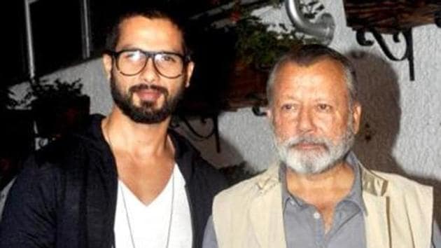 Shahid Kapoor poses with dad Pankaj Kapur at an event.