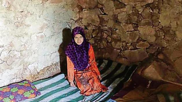 A girl sitting inside a bunker at a village in Uri. (HT Photo) A girl sitting inside a bunker at a village in Uri. (HT Photo)