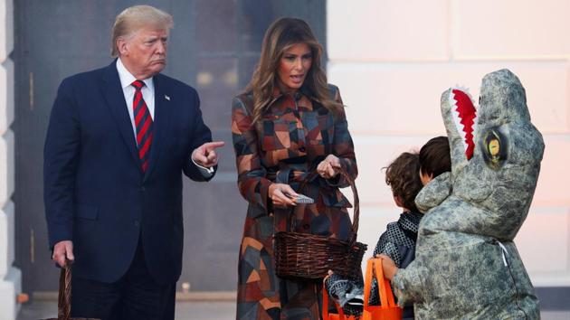 US President Donald Trump and first lady Melania Trump hand out Halloween candy to visiting schoolchildren in advance of Halloween at the White House in Washington. (Tom Brenner / REUTERS) US President Donald Trump and first lady Melania Trump hand out Halloween candy to visiting schoolchildren in advance of Halloween at the White House in Washington. (Tom Brenner / REUTERS)
