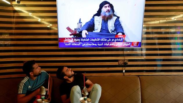 Iraqi youth watch the news of Islamic State leader Abu Bakr al-Baghdadi’s in a US raid death, in Najaf, Iraq. (Alaa al-Marjani / REUTERS) Iraqi youth watch the news of Islamic State leader Abu Bakr al-Baghdadi’s in a US raid death, in Najaf, Iraq. (Alaa al-Marjani / REUTERS)