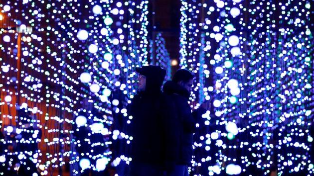 People take photographs in an installation called 'submergence' which forms part of the River of Light festival in Liverpool, Britain, October 31. (REUTERS)