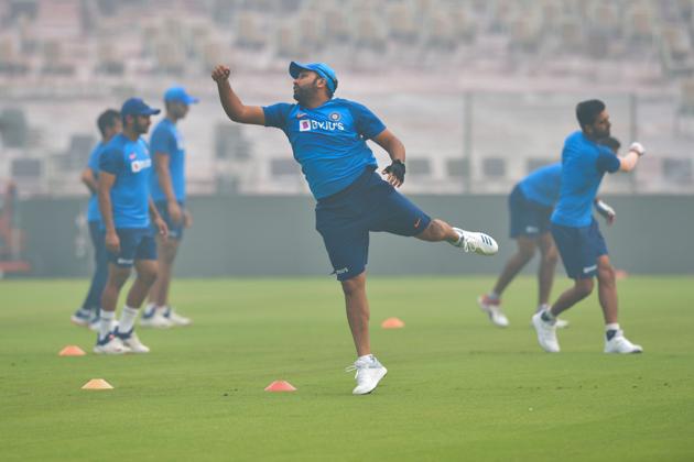 India's Rohit Sharma (C) tries to catch a ball during a practice session at Arun Jaitley Cricket Stadium in New Delhi ahead of the first T20 international cricket match between India and Bangladesh. (AFP)