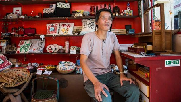 Louis To surrounded by bric-a-brac at his shop. “During this period, there was no food, there was nothing,” recalled To, who was born in Chaozhou, southern China. “So when I saw other children with toys, I tried to make replicas for myself.” (Isaac Lawrence / AFP) Louis To surrounded by bric-a-brac at his shop. “During this period, there was no food, there was nothing,” recalled To, who was born in Chaozhou, southern China. “So when I saw other children with toys, I tried to make replicas for myself.” (Isaac Lawrence / AFP)