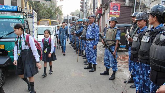 Security personnel stand guard along a road in Jammu. (PTI) Security personnel stand guard along a road in Jammu. (PTI)