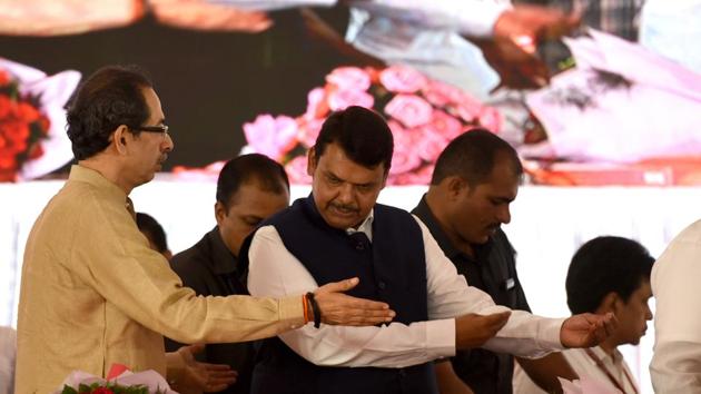 Maharashtra CM Devendra Fadnavis & Shiv Sena Chief Uddhav Thackeray during 86th birth anniversary of Late Mathadi Leader AnnaSaheb Patil at APMC Onion Potato Market Vashi in Navi Mumbai.(Hindustan Times) Maharashtra CM Devendra Fadnavis & Shiv Sena Chief Uddhav Thackeray during 86th birth anniversary of Late Mathadi Leader AnnaSaheb Patil at APMC Onion Potato Market Vashi in Navi Mumbai.(Hindustan Times)