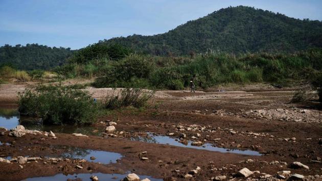A dried riverbank area of Mekong River in Pak Chom district. Landlocked and impoverished Laos has set its sights on becoming “the battery of Asia”, with 44 operating hydro plants and 46 more under construction many on key tributaries of the Mekong, according to monitor International Rivers. (Lillian Suwanrumpha / AFP)