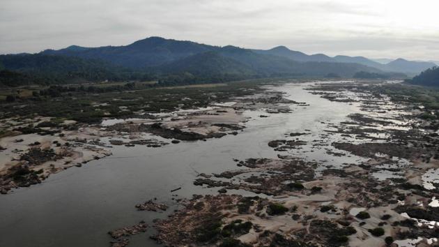 The Mekong River in Pak Chom district in Thailand with the Laos side at left. From above, the encroaching banks of Laos and Thailand are now a thread of water apart, restricting fishing grounds to a slim channel. Fishermen blame a combination of this year’s weak monsoon and the Xayaburi dam, around 300 kilometres to the north. (Lillian Suwanrumpha / AFP)