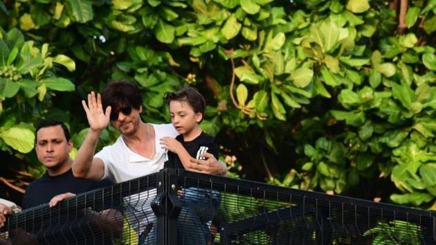 Shah Rukh Khan waves to fans on his birthday as son Abram looks on.(Varinder Chawla)