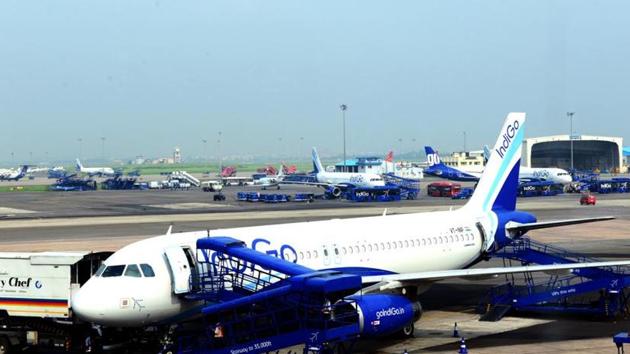 An Indigo plane alights its passengers at an airport.(Ramesh Pathania)
