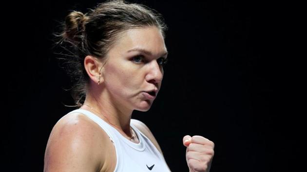 Romania's Simona Halep reacts during her group stage match against Czech Republic's Karolina Pliskova.(REUTERS)