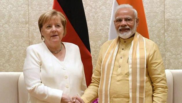 Prime Minister Narendra Modi shakes hands with German Chancellor Angela Merkel at Lok Kalyan Marg in New Delhi.(PTI Photo)
