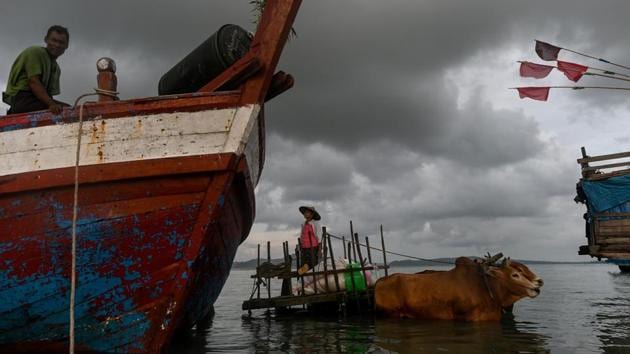 People use a bull cart to transport goods from a boat at Japanma jetty in Kyaukphyu, Rakhine State, Myanmar. (Ye Aung Thu / AFP) People use a bull cart to transport goods from a boat at Japanma jetty in Kyaukphyu, Rakhine State, Myanmar. (Ye Aung Thu / AFP)