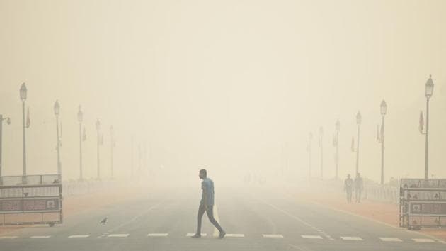 A man walks past the India Gate engulfed in heavy smog, at Rajpath. According to the Central Pollution Control Board’s (CPCB) 4pm bulletin, Delhi’s average air quality index (AQI) was at 484 — up from 410 the day before — while the concentration of PM2.5 and PM10 dust particles crossed “emergency” thresholds at midnight. In Noida, the AQI was 499, while it was 496 in Ghaziabad and 469 in Gurugram. (Biplov Bhuyan / HT Photo) A man walks past the India Gate engulfed in heavy smog, at Rajpath. According to the Central Pollution Control Board’s (CPCB) 4pm bulletin, Delhi’s average air quality index (AQI) was at 484 — up from 410 the day before — while the concentration of PM2.5 and PM10 dust particles crossed “emergency” thresholds at midnight. In Noida, the AQI was 499, while it was 496 in Ghaziabad and 469 in Gurugram. (Biplov Bhuyan / HT Photo)