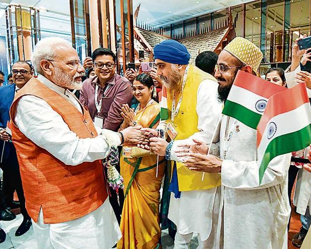 Prime Minister Narendra Modi greets members of the Indian community in Bangkok, Thailand. (PTI) Prime Minister Narendra Modi greets members of the Indian community in Bangkok, Thailand. (PTI)
