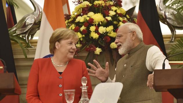 Prime Minister Narendra Modi interacts with German Chancellor Angela Merkel during their joint press conference, at Hyderabad House, in New Delhi. (Sanjeev Verma / HT Photo)