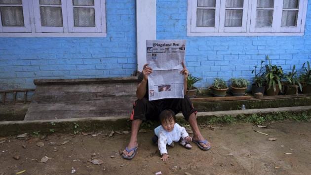 A man reads a newspaper carrying headlines of the Naga peace talks in Kohima, Nagaland. Various Naga groups are currently holding talks with the Indian government with hopes of finding an honorable solution to their demand for self-determination. The Indian government has ruled out the possibility of a separate constitution and a Naga flag as demanded by the NSCN (IM), the largest rebel group. (Yirmiyan Arthur / AP)