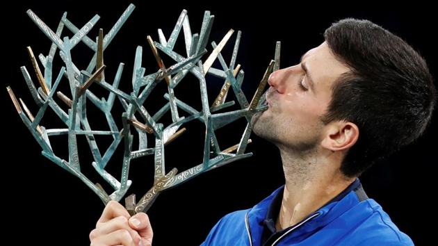Serbia's Novak Djokovic celebrates with the trophy after winning the Paris Masters.(REUTERS)